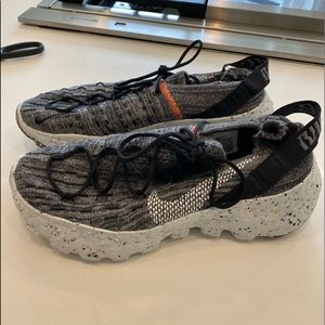 Nike Women's Gray Knit Athletic Sneakers with Black and Orange Accents